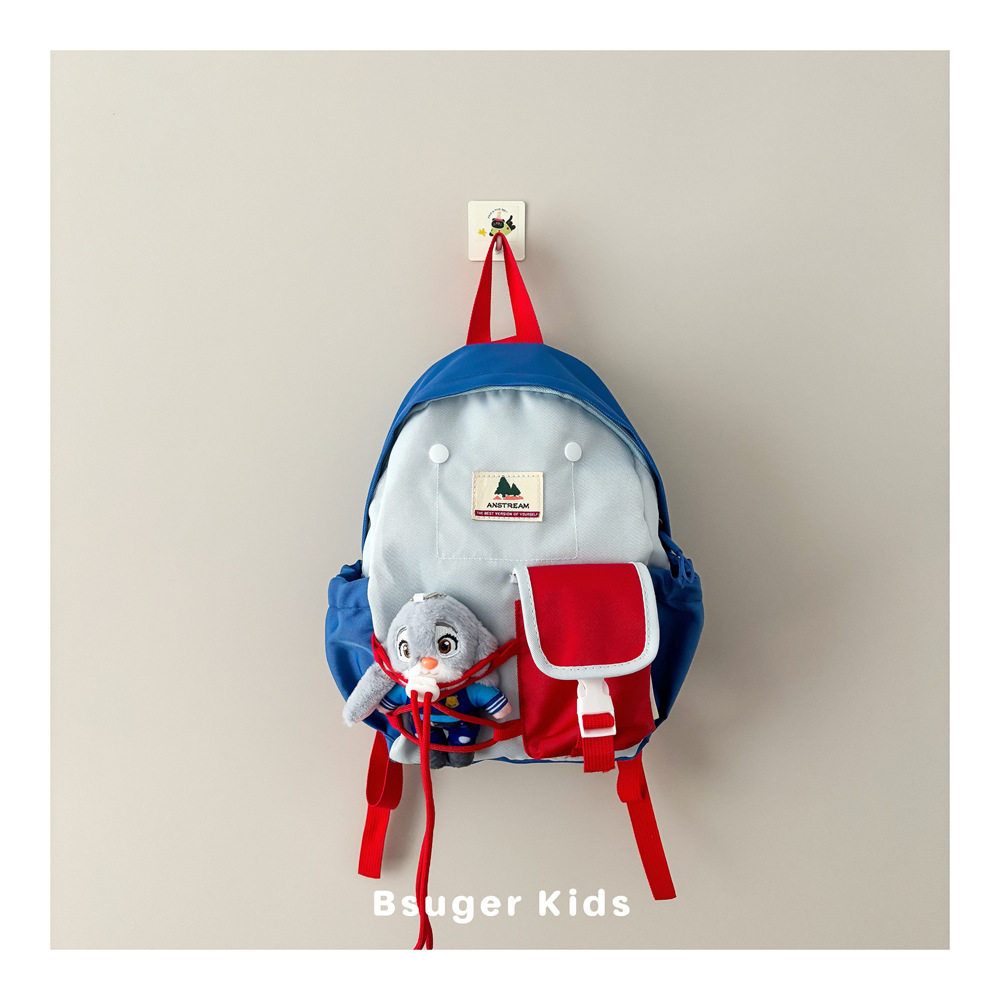 Trendy color-blocking children's backpack with detachable plush toy, suitable for boys and girls in kindergarten, ideal for outings