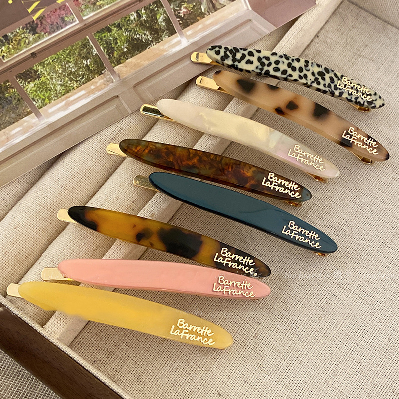 Horquilla florecilla simple primavera y verano nuevo estilo retro moda todo fósforo clip lateral de una palabra sentido de alta calidad temperamento exquisito accesorios para el cabello