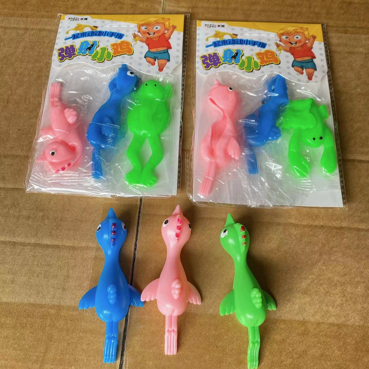 Catapulta de pollo de lanzamiento de pollo 2 yuanes tienda por departamento puesto al por mayor juguetes niños diversión elasticidad