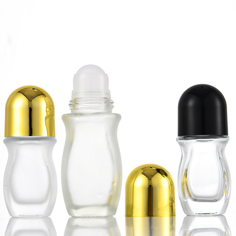 Venta al por mayor de vidrio transparente 50ml botella de bola de rodillo 30ml aceite esencial aceite de medicina cuerpo masaje botella de cuentas dolor botella grande