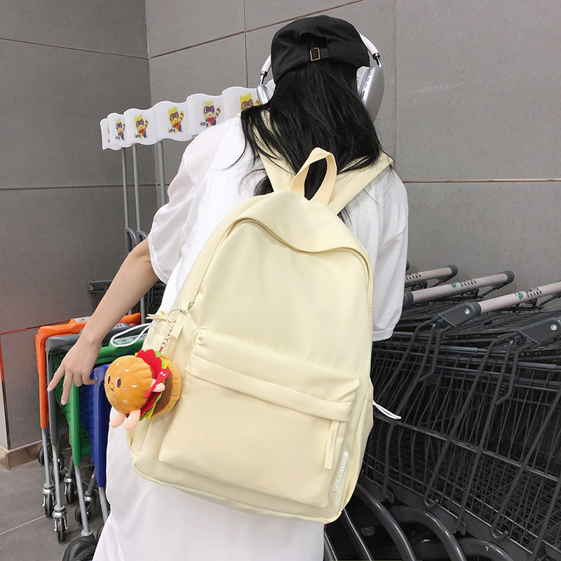 Mochila al por mayor verano nuevo caramelo color japonés simple mochila de las mujeres Junior High School moda gran capacidad mochila