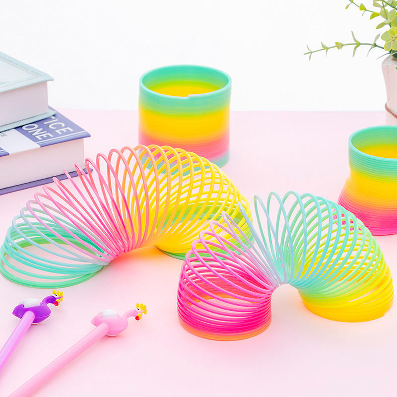 Anillo mágico de arco iris para niños juguete de inteligencia jengle anillo elástico luminoso para niños y niñas regalo colorido anillo de primavera