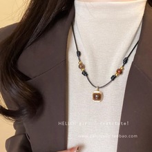 虎眼石编织皮绳项链女2024新款轻奢小众感毛衣链叠戴配饰
