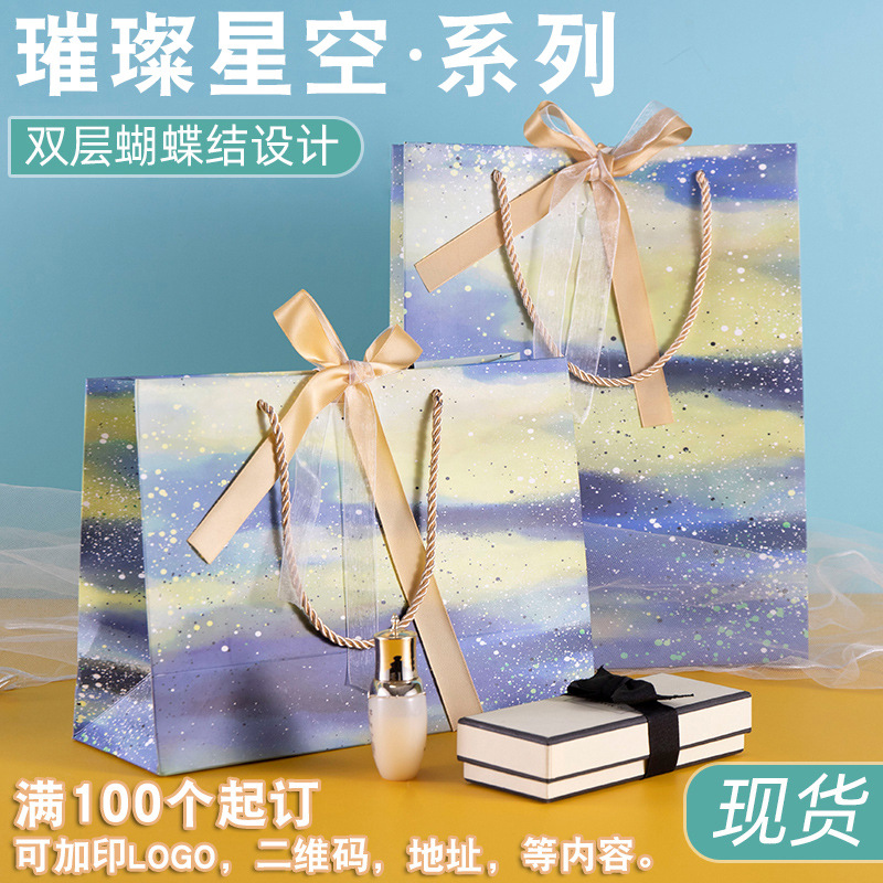 优惠加厚白卡纸袋服装袋蝴蝶结礼品袋购包装手提袋节日送礼手拎袋