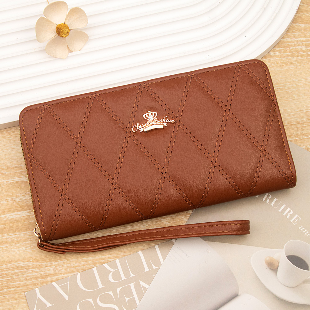Solid-color PU women's long wallet, featuring a diamond-patterned crown design, multiple compartments, large capacity, and a wrist strap for easy carrying