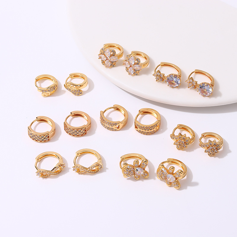 DongDamen simple lujo ligero alto sentido nicho de diseño único bucles de orejas de cobre micro-incrustado 18 quilates oro retrógrado pendientes únicos