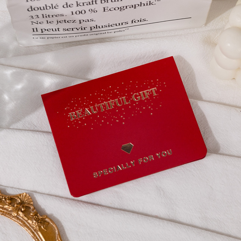 Tarjeta de felicitación con lámina de oro rojo; accesorios
