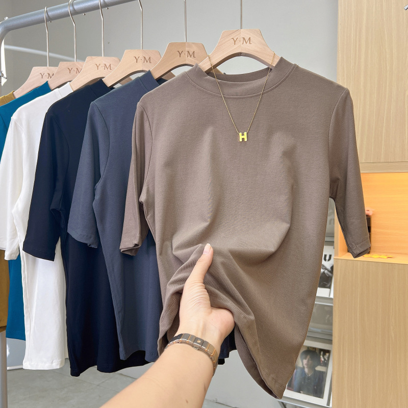 高品質の弾力綿五分袖の上着の女性の丸首の純色の中袖の底のシャツのゆったりしているtシャツは代行して明らかにします。|undefined