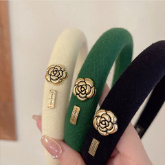 Korean-style Chanel-inspired camellia-textured black sponge hairband for women—stylish high-top headwear to tame and lift your hair.
