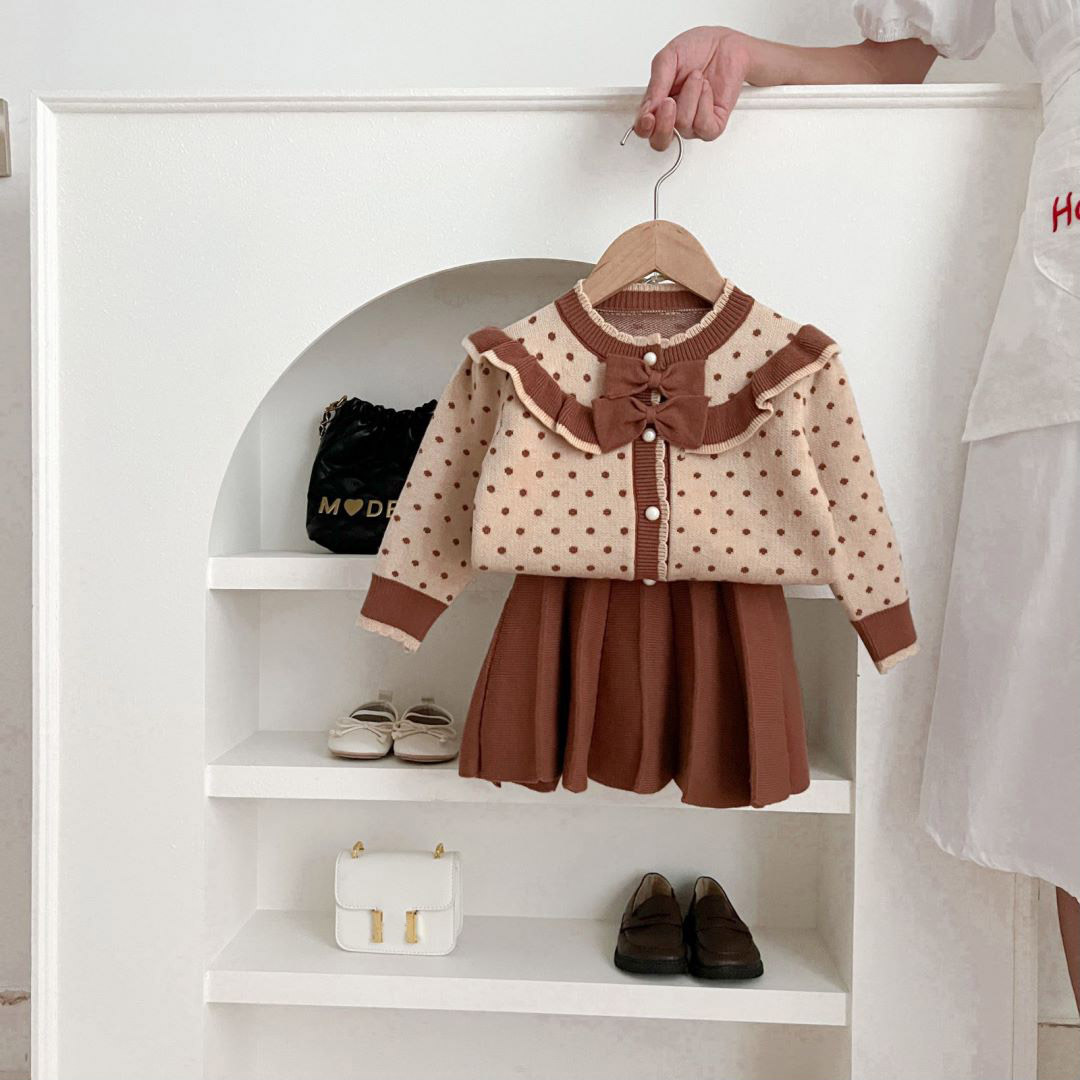 Flickor prickiga barnkläder med rosett och westernstil 2023 höst/vinter nytt koreanskt stickat set med två delar_voghion.com