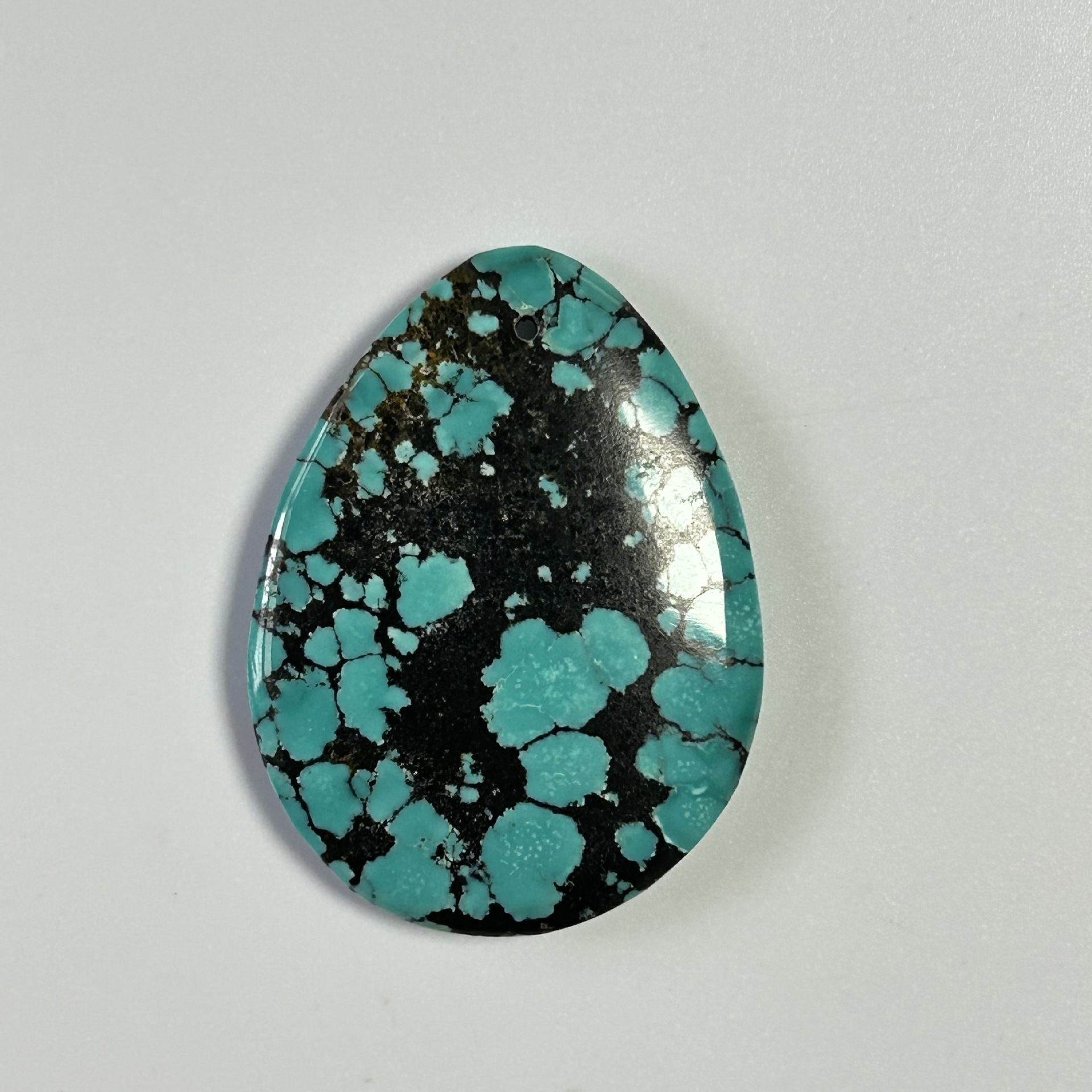 Organic turquoise pendant drop-shaped