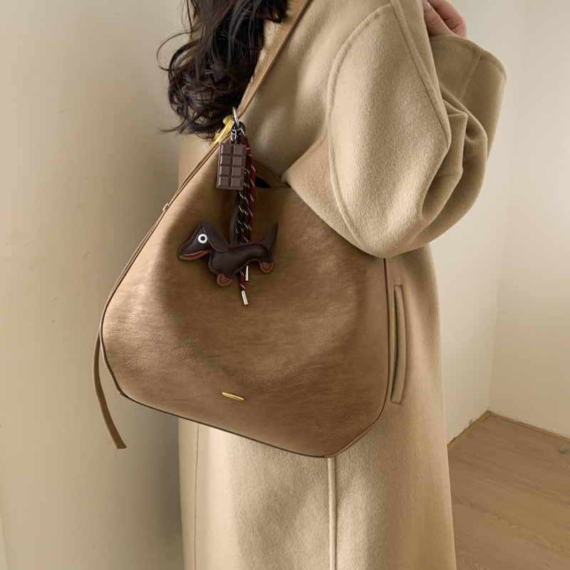 BENL alta sensación de bolso de invierno para mujeres 2025, nuevo tipo de gran capacidad, bolso de cubo de transporte, bolso de hombro de viaje