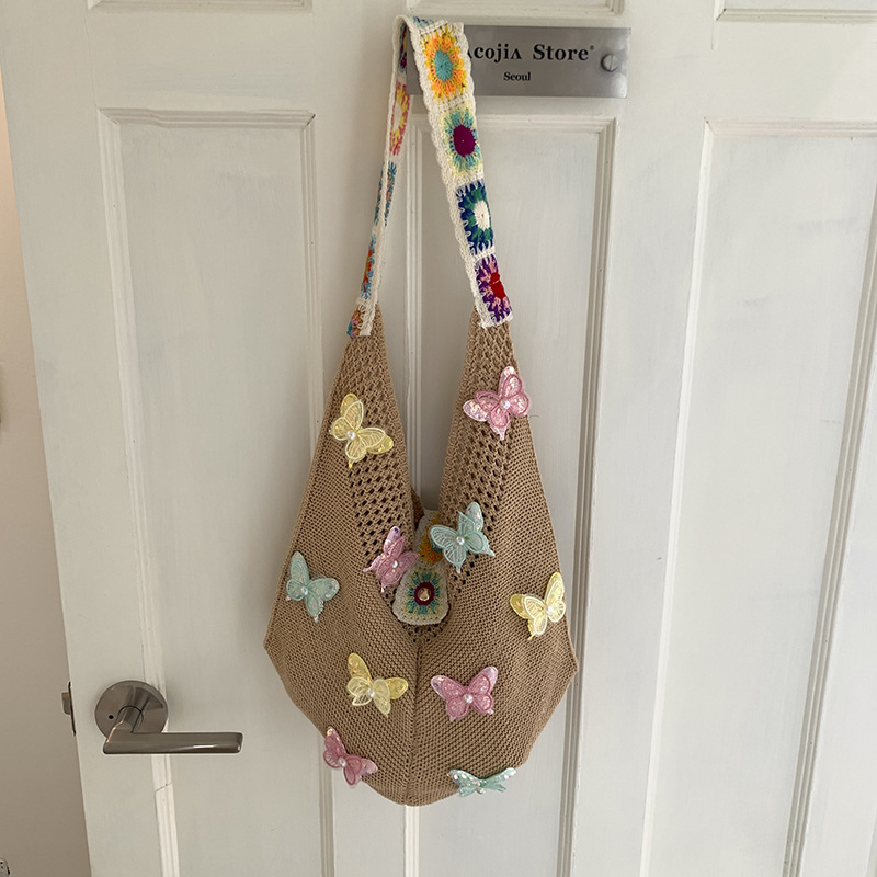 Versión coreana del bolso de nicho 2025 verano nuevo bolso femenino mariposa bolso tejido bolso de hombro de punto de gran capacidad
