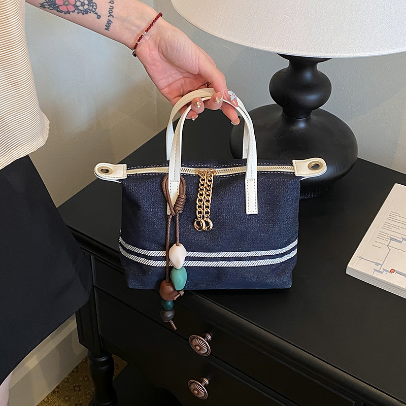 Tela estriada bolso de bolsillo de mano mujer 2026 venta caliente nuevo estilo de alta calidad sensación de moda versátil bolso de hombro
