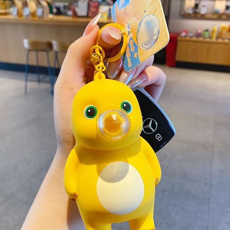 Online Celebrity schoolbag adornos genuino descompresión burbuja leche dragón llavero femenino exquisito creativo pellizcar música colgante clave