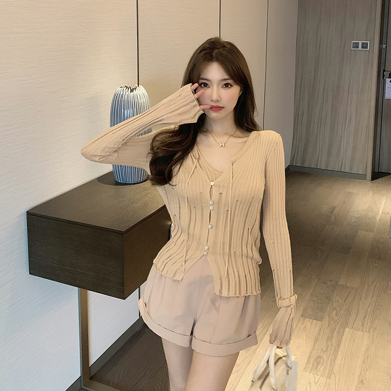 There Are Many Silk and Linen Knitted Two-Piece Set with Small Details. Designed Ripped Cardigan with Vest Top Inside