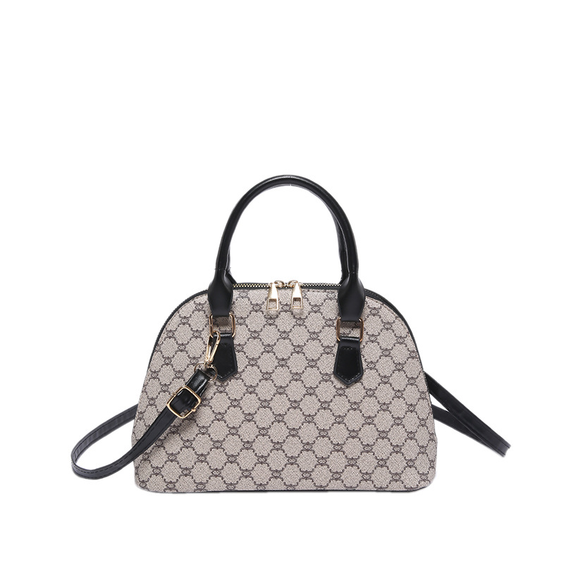 Bolso de moda simple 2024 primavera nueva bolsa de hombro de viaje de estilo extranjero bolso de mano casual bolso de concha de mujer