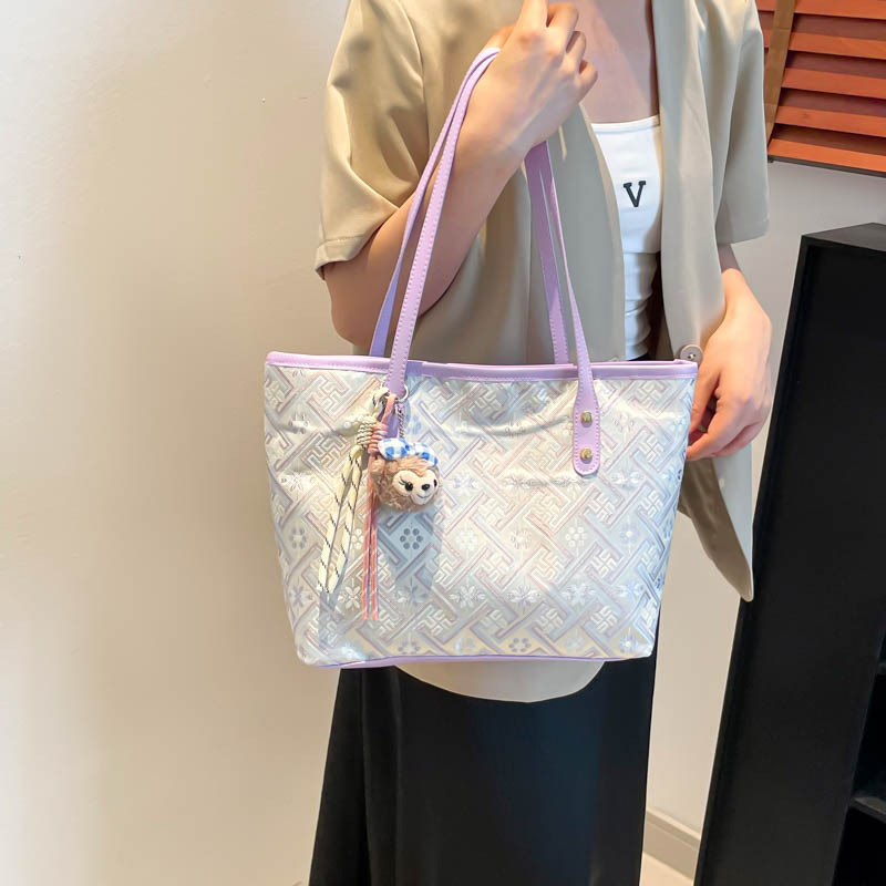 2025 nuevo estilo nacional de diseño de patrón oscuro bolso de mujer gran capacidad versátil bolso de viaje bolso de hombro de moda ligero de lujo