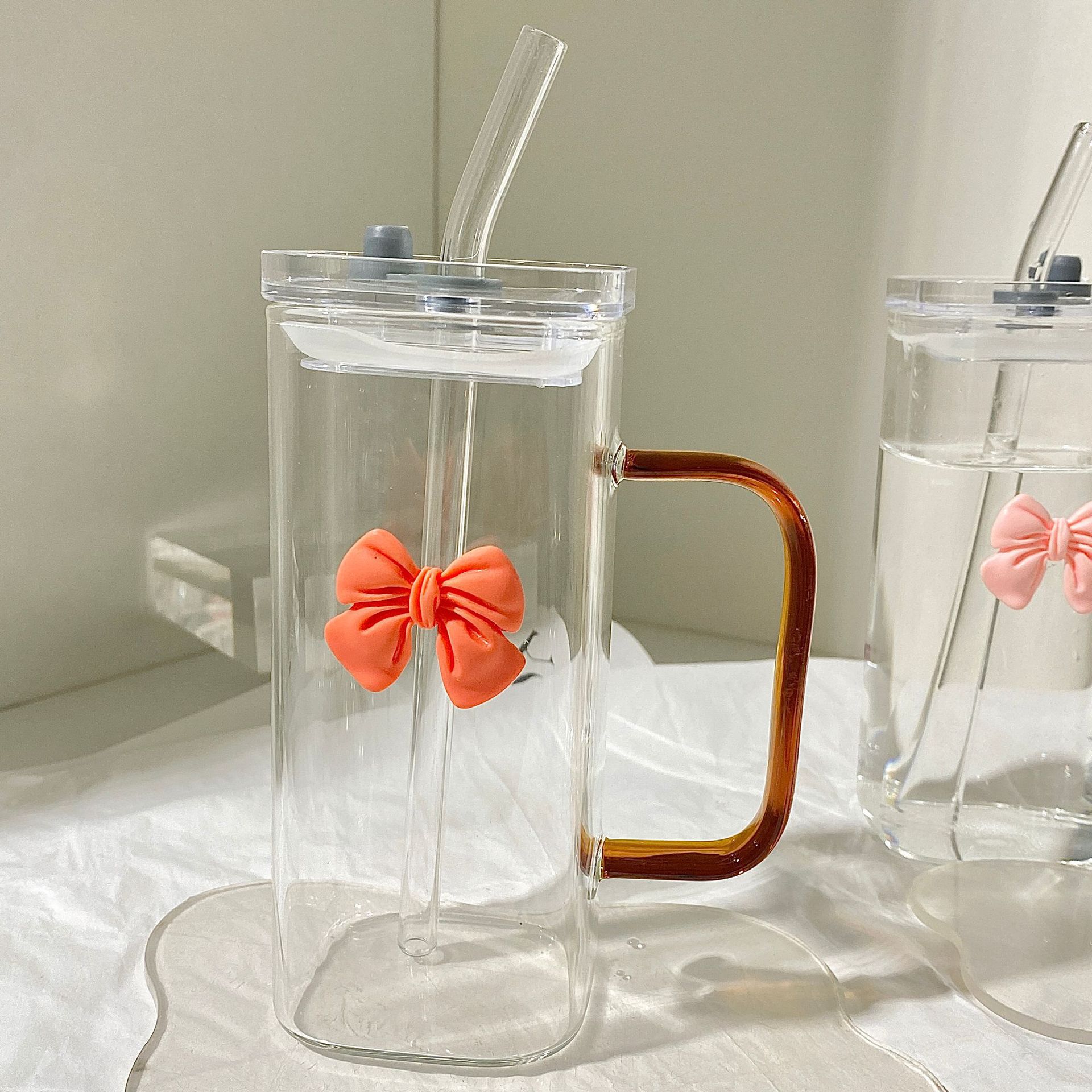 Amber orange transparent straw with bow, glass cover
