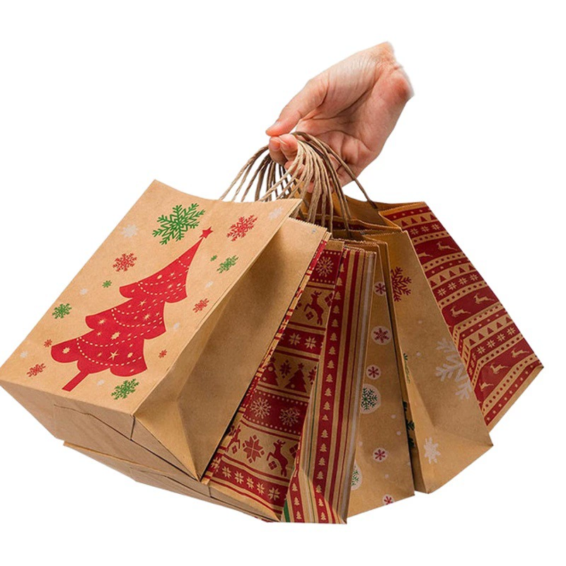 Оптовая продажа рождественских подарочных пакетов из крафт-бумаги с снежинками, готовых к продаже за рубежом