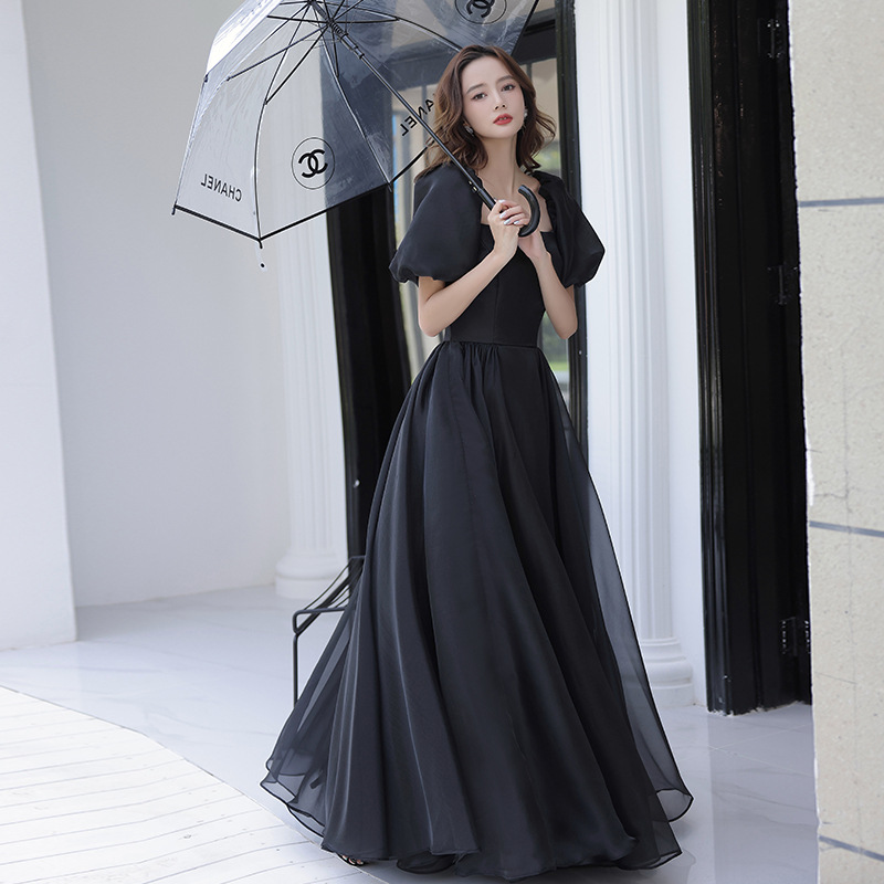 Vestido de noche negro para mujer, estilo nuevo de otoño 2025, manga abullonada, satén, para anfitriona de reunión anual, pasarela