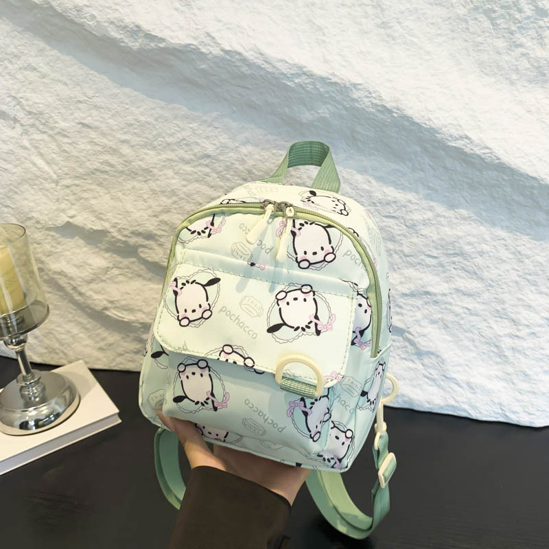 Mochila nueva al por mayor 2025, mochila de tela Oxford con diseño de dinosaurio de dibujos animados, mochila pequeña de gran capacidad para actividades al aire libre y ocio.