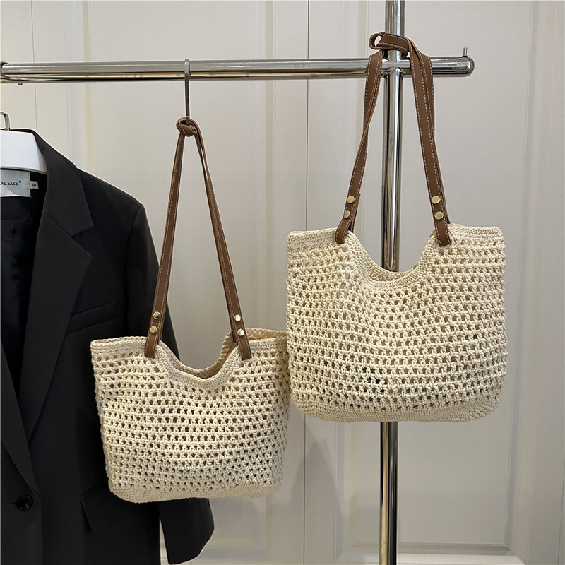 Bolsas de paja transfronterizas bolsas de mujer 2025 nueva moda simple gran capacidad bolsa de hombro hueco bolsa de playa bolsa de bolsa