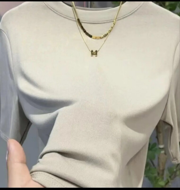 高品質の弾力綿五分袖の上着の女性の丸首の純色の中袖の底のシャツのゆったりしているtシャツは代行して明らかにします。|undefined