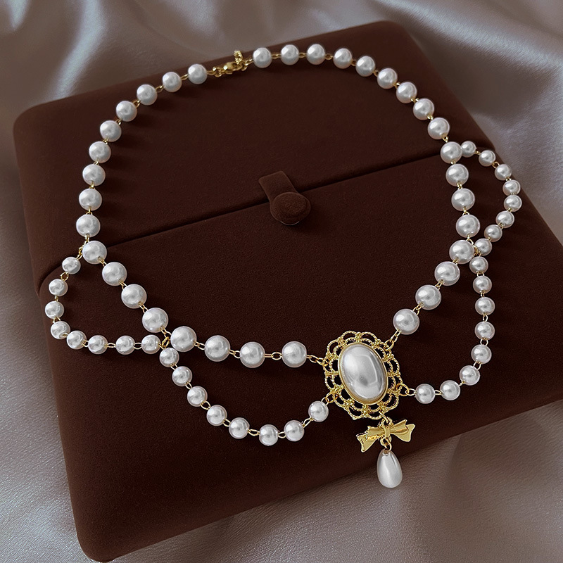 Elegante collana girocollo perle barocche con ciondolo oro_voghion.com