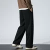 Black trousers, loose straight fit