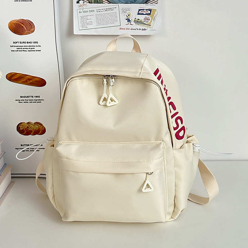 Mochila de gran capacidad para estudiantes de secundaria femenina simple y versátil para estudiantes de secundaria japonesa mochila de diseño