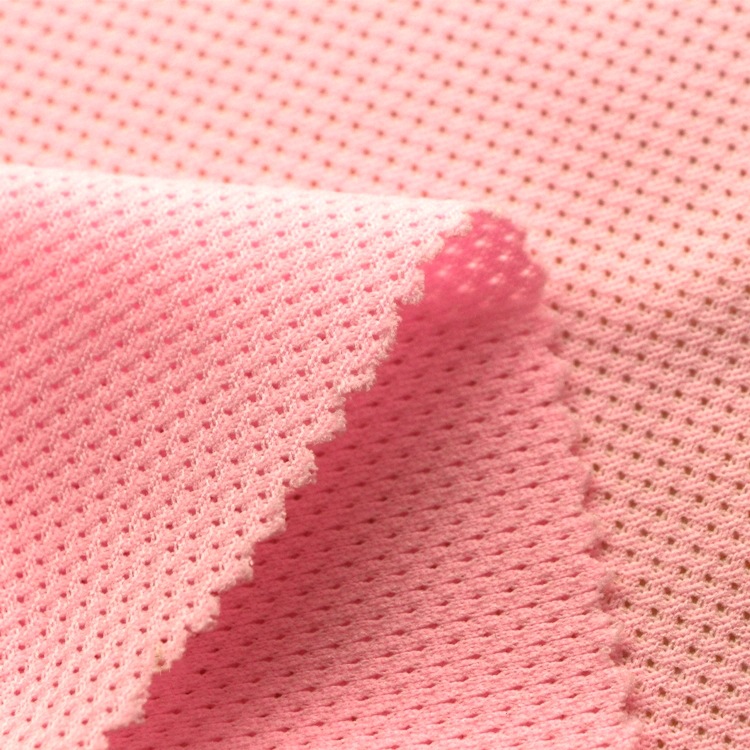 吸湿排汗荧光网眼布料针织纬编全涤无弹速干荧光染色菱形网眼布料