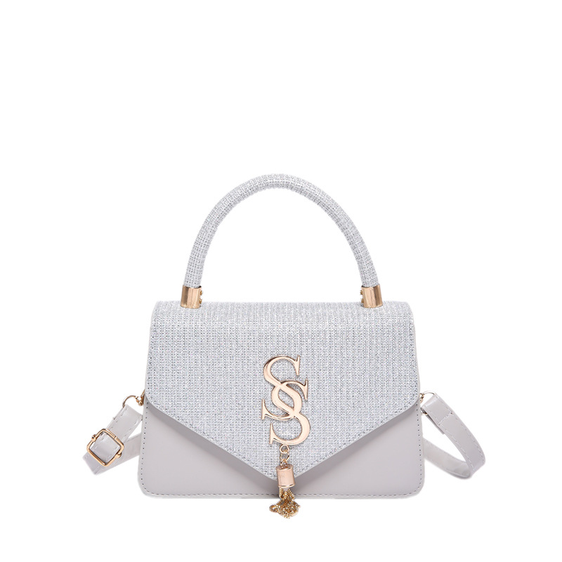 Bolsos de textura, la nueva moda de este año, la cadena de borlas de letras, el pequeño bolso cuadrado, la moda de las mujeres, el bandolera de un solo hombro