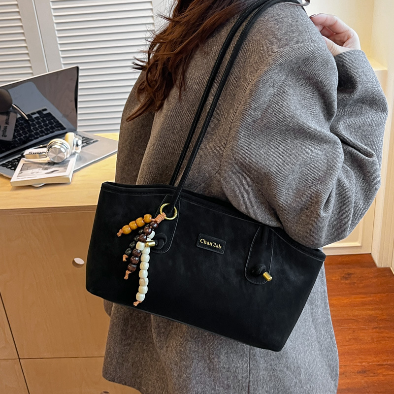Bolsa de hombro casual coreana de nicho retro simple bolsa de brazo de viaje para mujeres 2025 nueva moda bolsa de mano