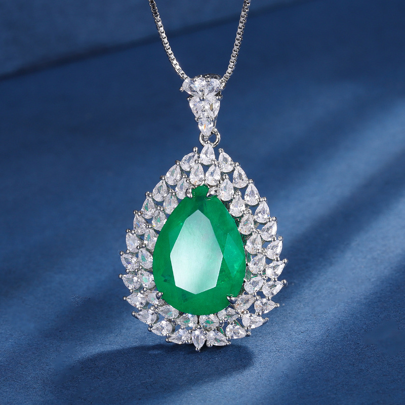 Zhuang Sheng joyería cobre inferior oro plateado traje europeo y americano simulación color tesoro gota de agua diamante anillo colgante 13*18