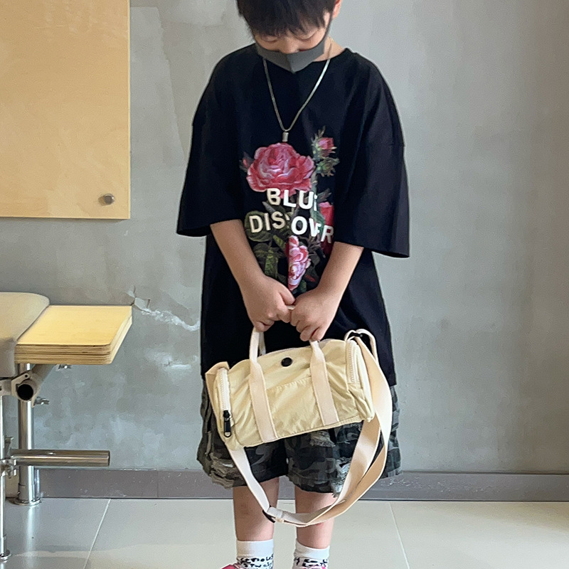 Bolso de hombro para niños y niñas de estilo coreano, color de contraste de moda, bolso de tubo portátil para bebé simple casual, nuevo bolso de almohada para niños