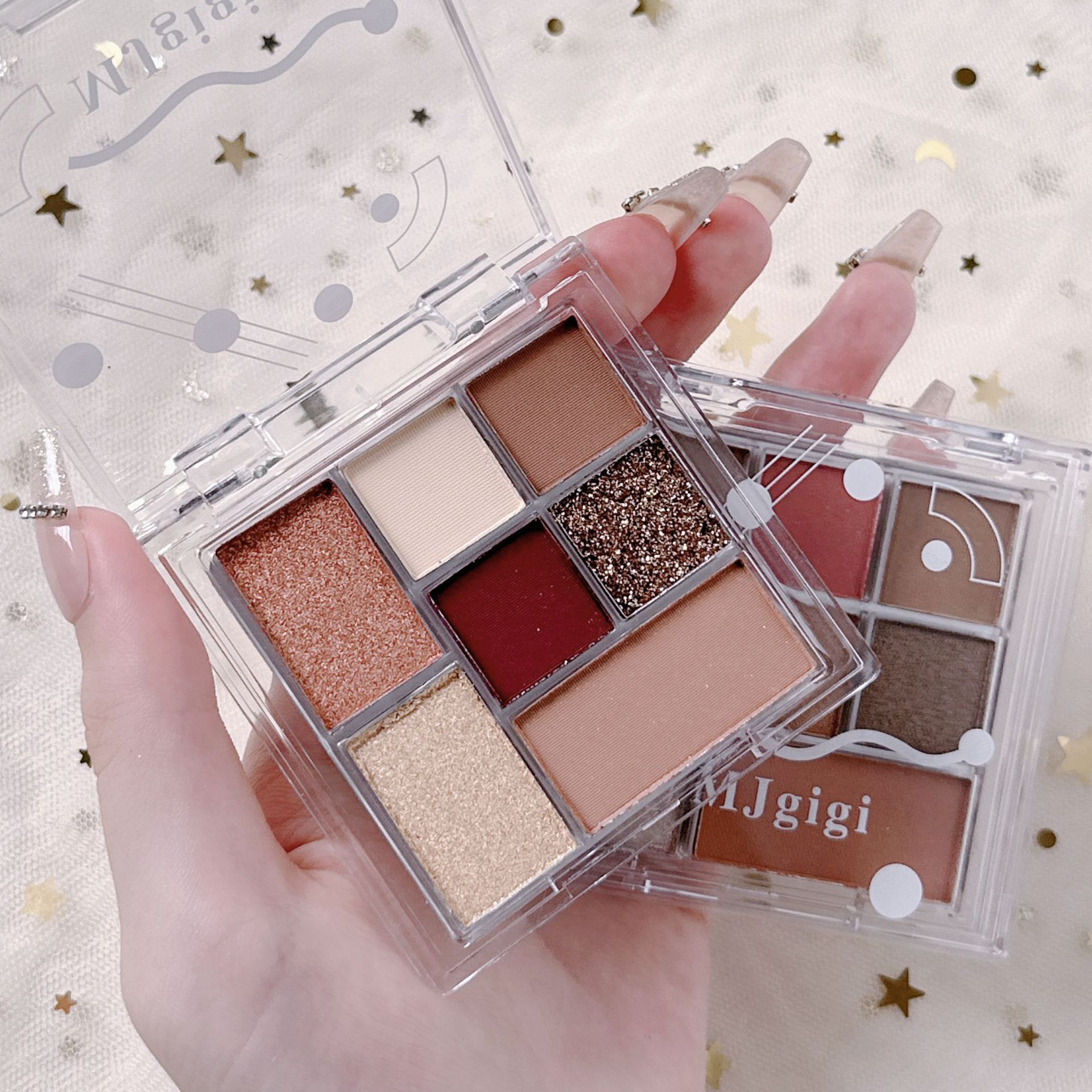 MJgigi sombra de ojos transparente de siete colores color tierra mate perlado impermeable a prueba de sudor sin manchas paleta de sombras de ojos de 7 colores al por mayor