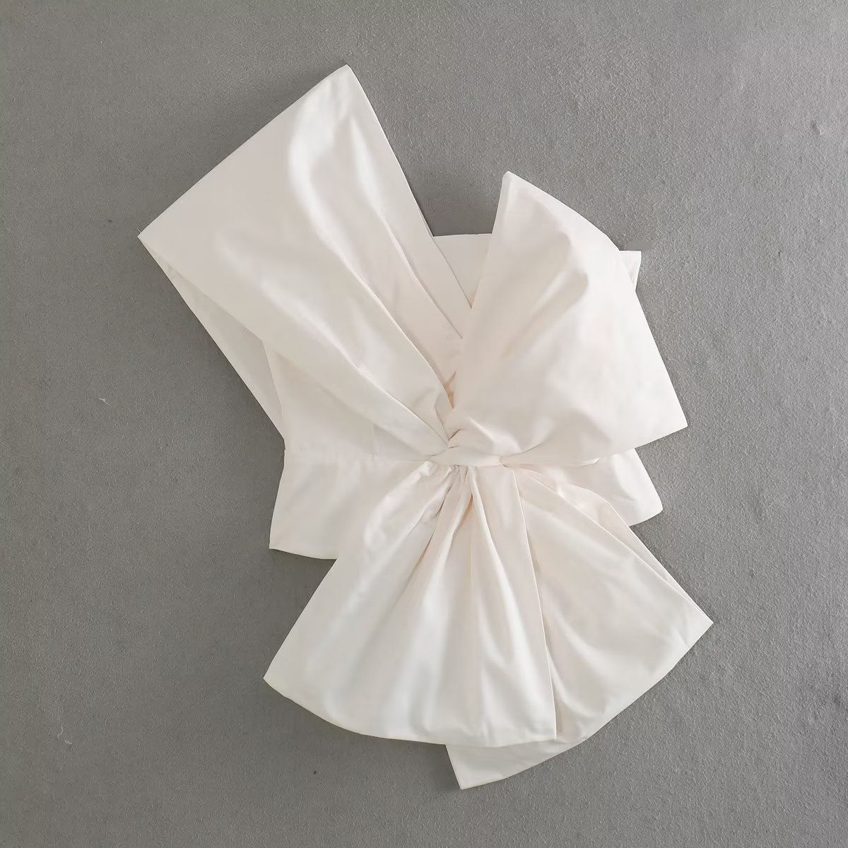 Spring asymmetrical bra top with bow