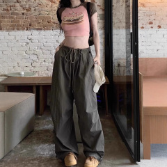 アメリカのレトロな傘兵の服装のズボンの女性の夏の薄いタイプの速乾のスポーツのズボンのゆったりしている感じの広足のズボンは地のズボンを引きずっています。