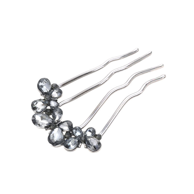 Un alto nivel de sensación de lujo ligero diamante mariposa peine de cabello tipo U de cuatro dientes enchufado peine de cabello temperamento bola de cabeza broca de cabello artefacto mágico