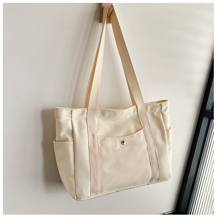 Wholesale of new women's single-shoulder bags, cross-border simple and casual canvas bags, Korean version LOGO printed commuter tote bags undefined