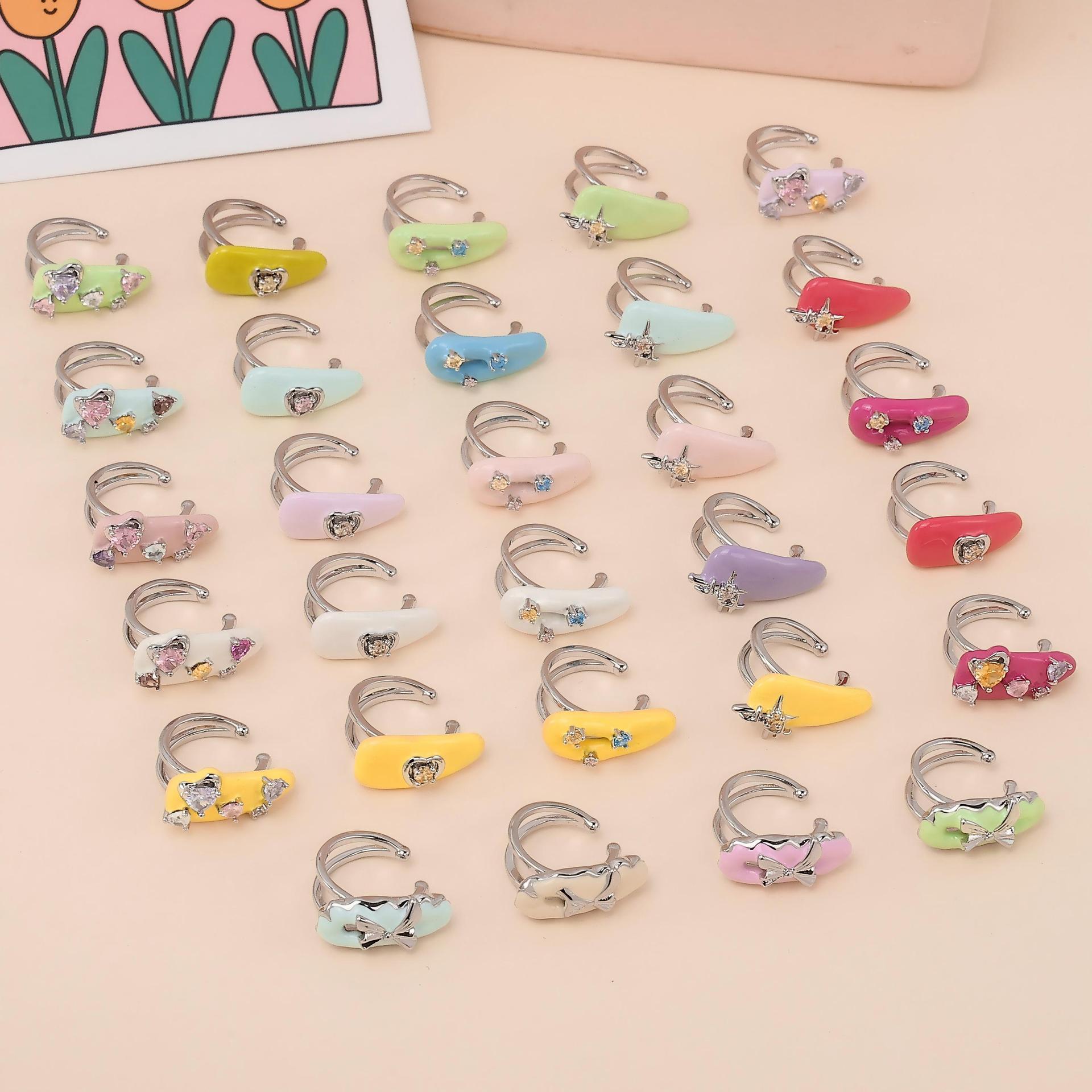 Japón y Corea del Sur dopamina color esmalte frío nicho de diseño original amor incrustado zircon diseño sin agujeros de orejas clip de hueso de orejas