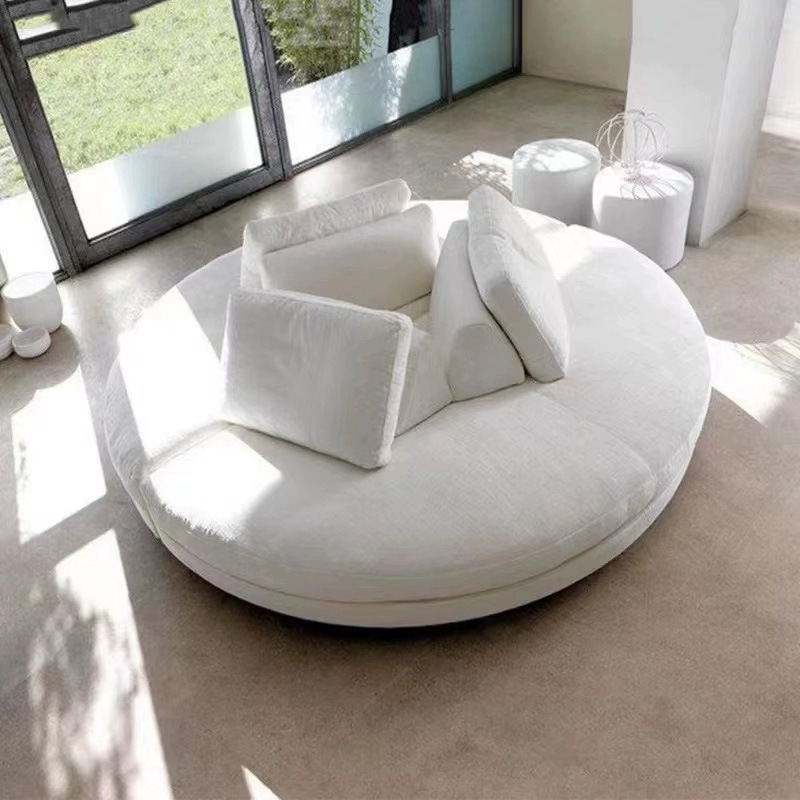 Nordic light luxury minimalist round sofa with Italian master design, hotel lobby leisure area, unconventional creative large sofa
