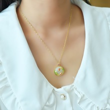 铜镶嵌和田玉鱼跃龙门时尚吊坠