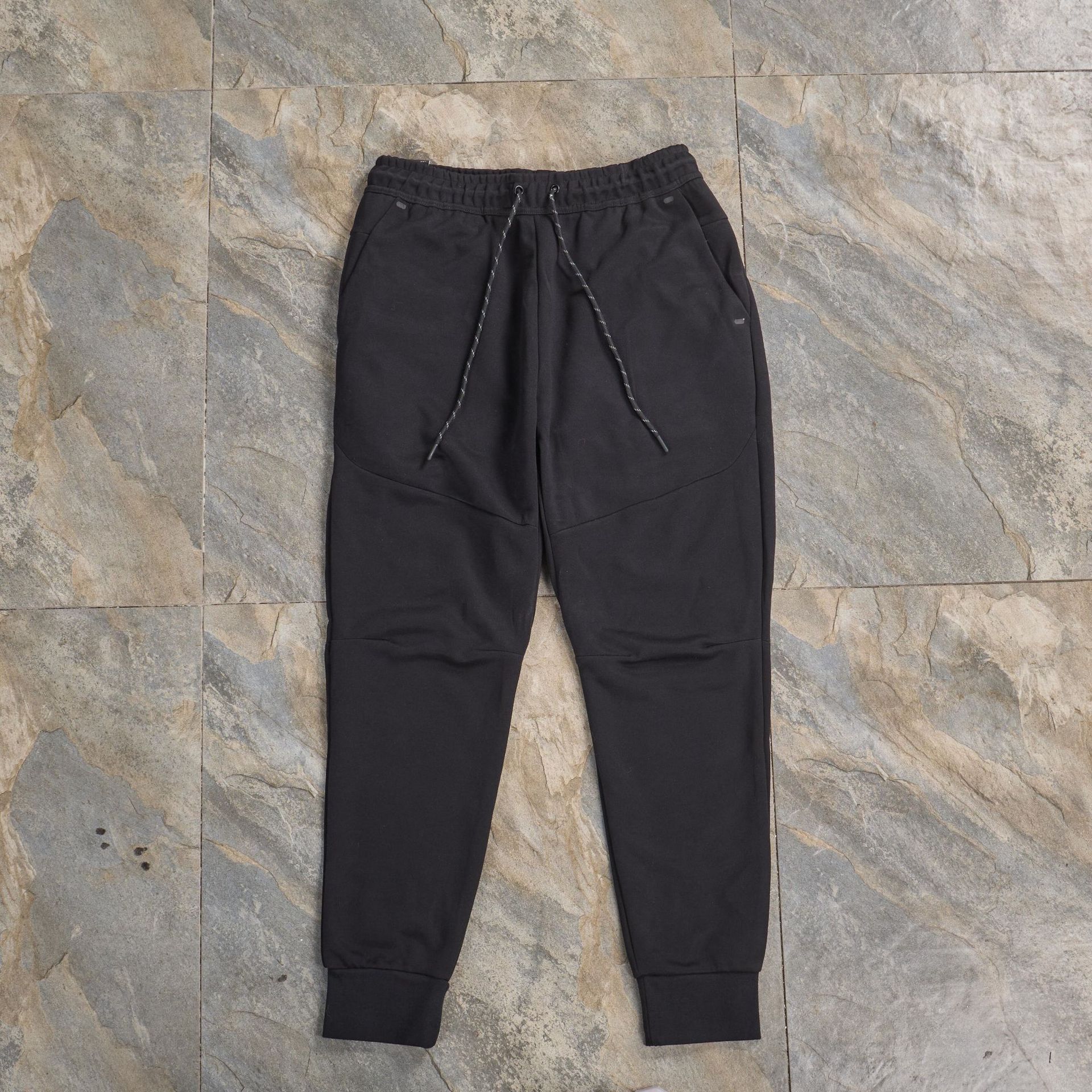 Pantalones casuales deportivos primavera y otoño aire laminado de algodón con cremallera pantalones deportivos para hombres y mujeres