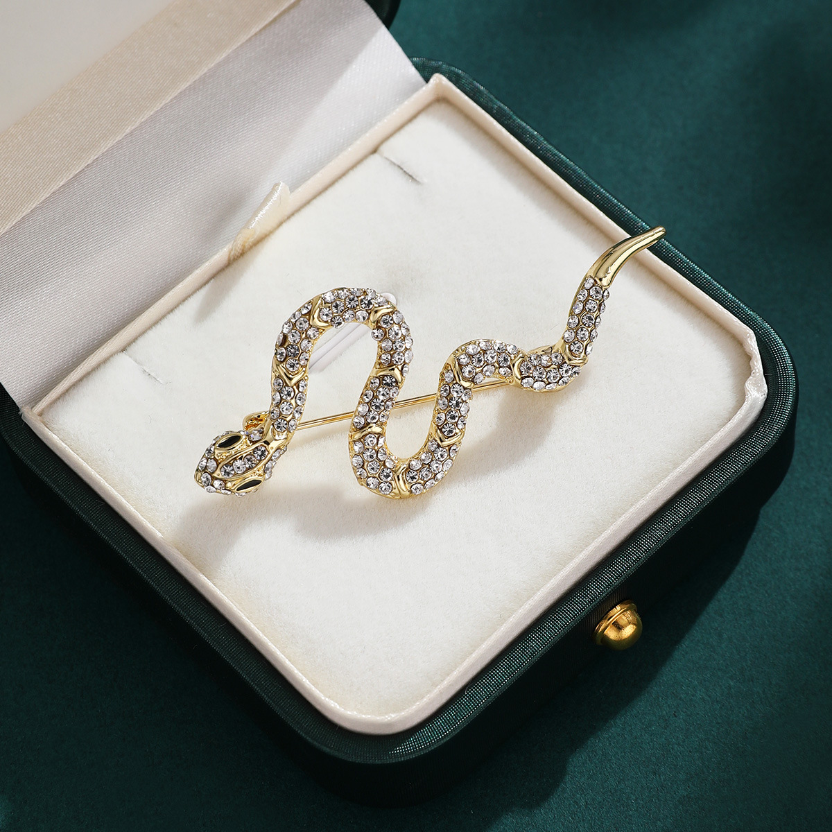 Luz lujosa retro diamantes broche de serpiente nicho de alto nivel creativo flor de pecho personalidad accesorios de alquiler al por mayor