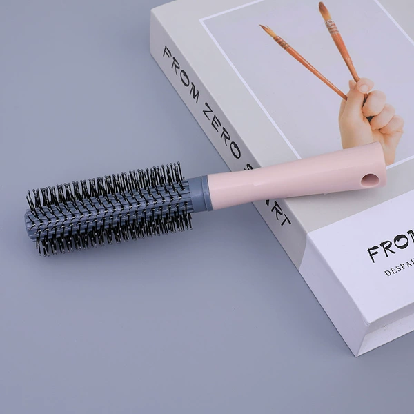 Pink curly hair comb