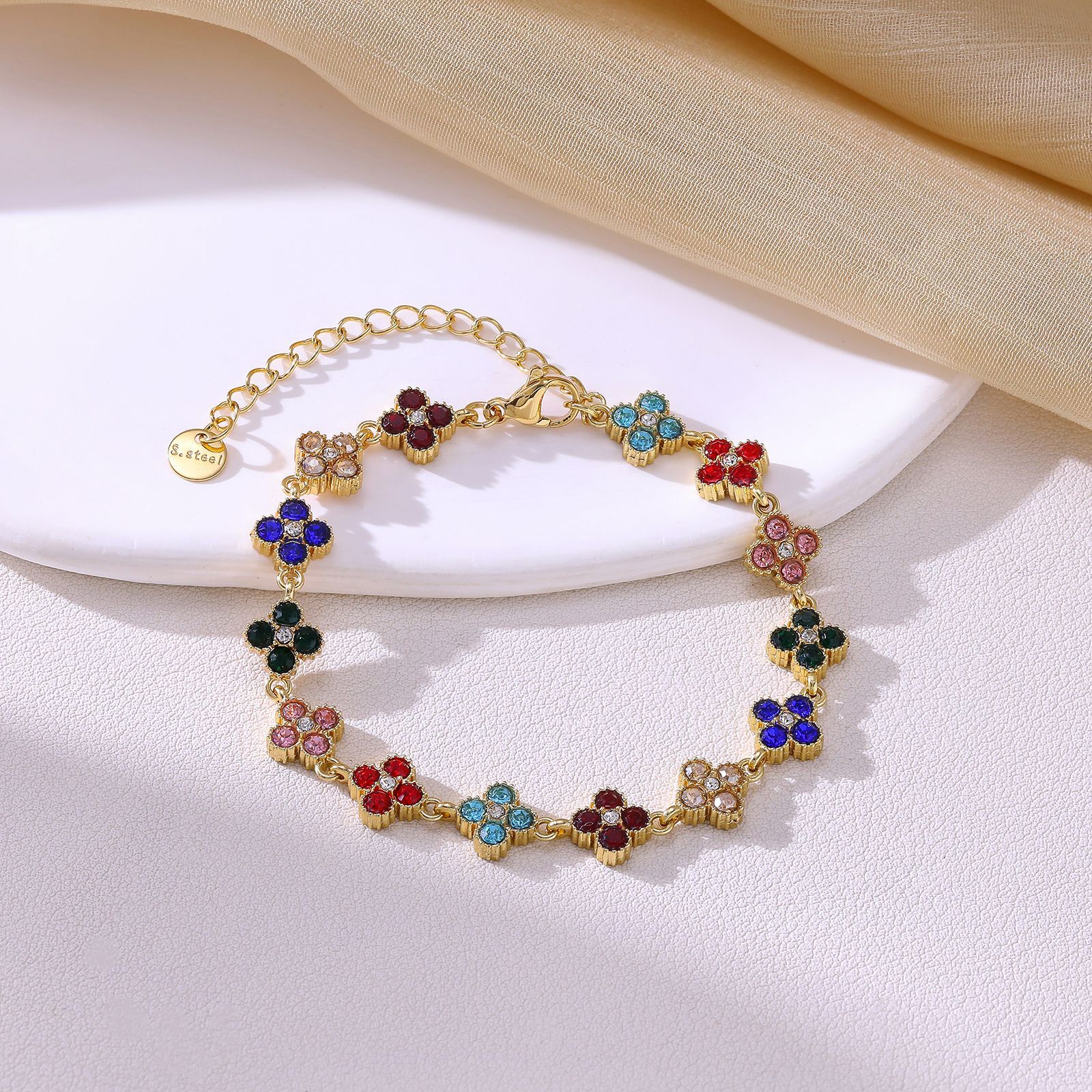Cross-border new titanium steel four-leaf clover bracelet with diamond accents, offering a luxurious and high-end look, featuring a full diamond design and colorful cubic zirconia, stainless steel bracelet