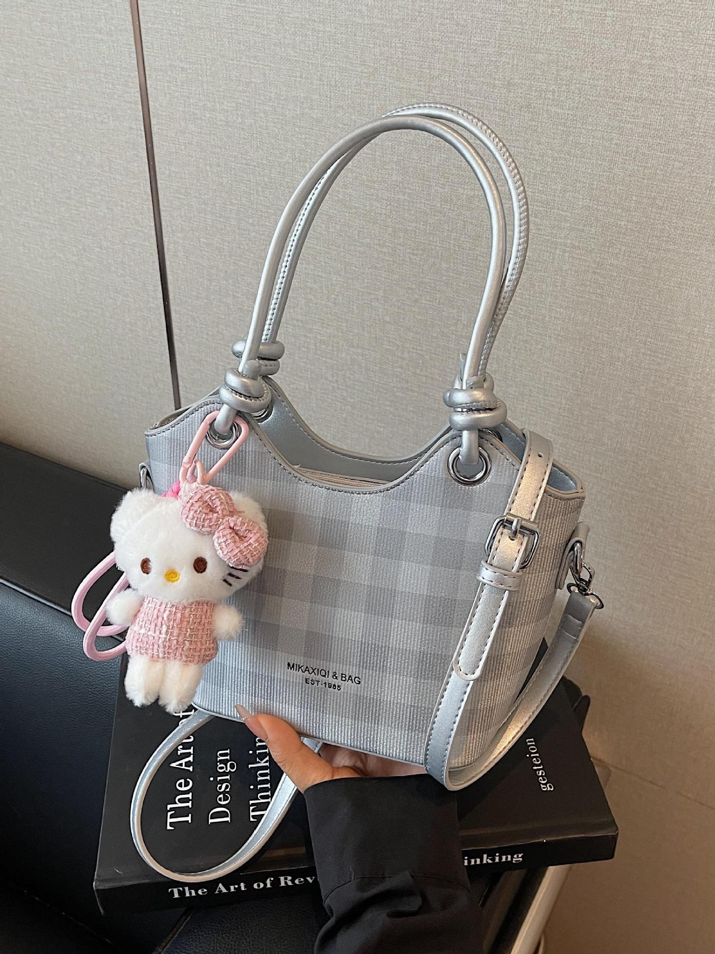 Bolsa de cubo de nicho a cuadrillas 2025, nuevo bolso de mano transfronterizo versátil de alta calidad, mochila de hombro de moda