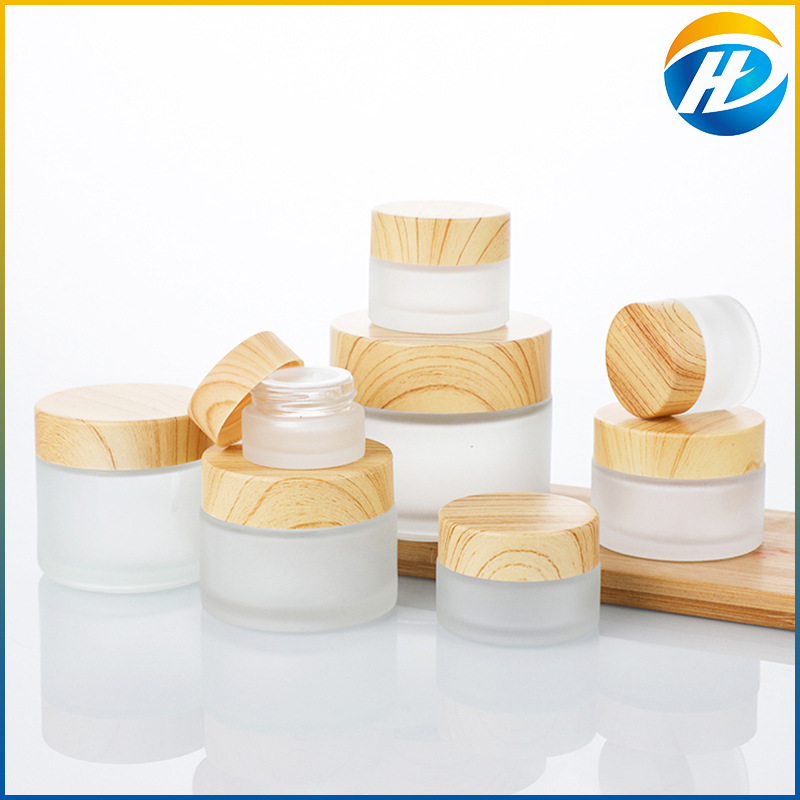 Venta al por mayor de madera grano cubierta botella de crema facial botella de crema botella cosmética de vidrio esmerilado 30g 50g crema sub-botella